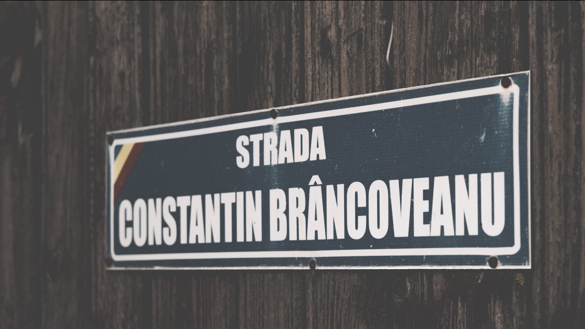 a sign on a wood fence